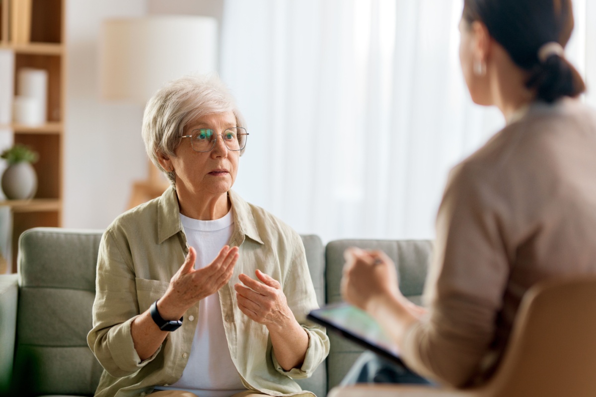 A senior woman speaking to her financial planner