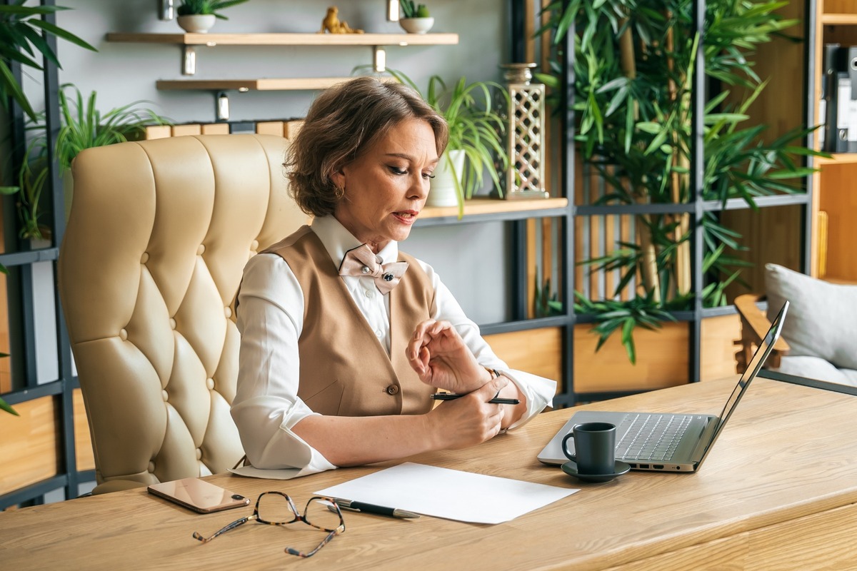 A professional woman working at her desk